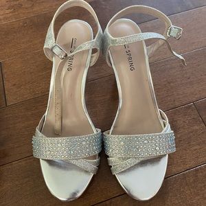 Size Us 6. Mini heels - silver glittery mini heel.